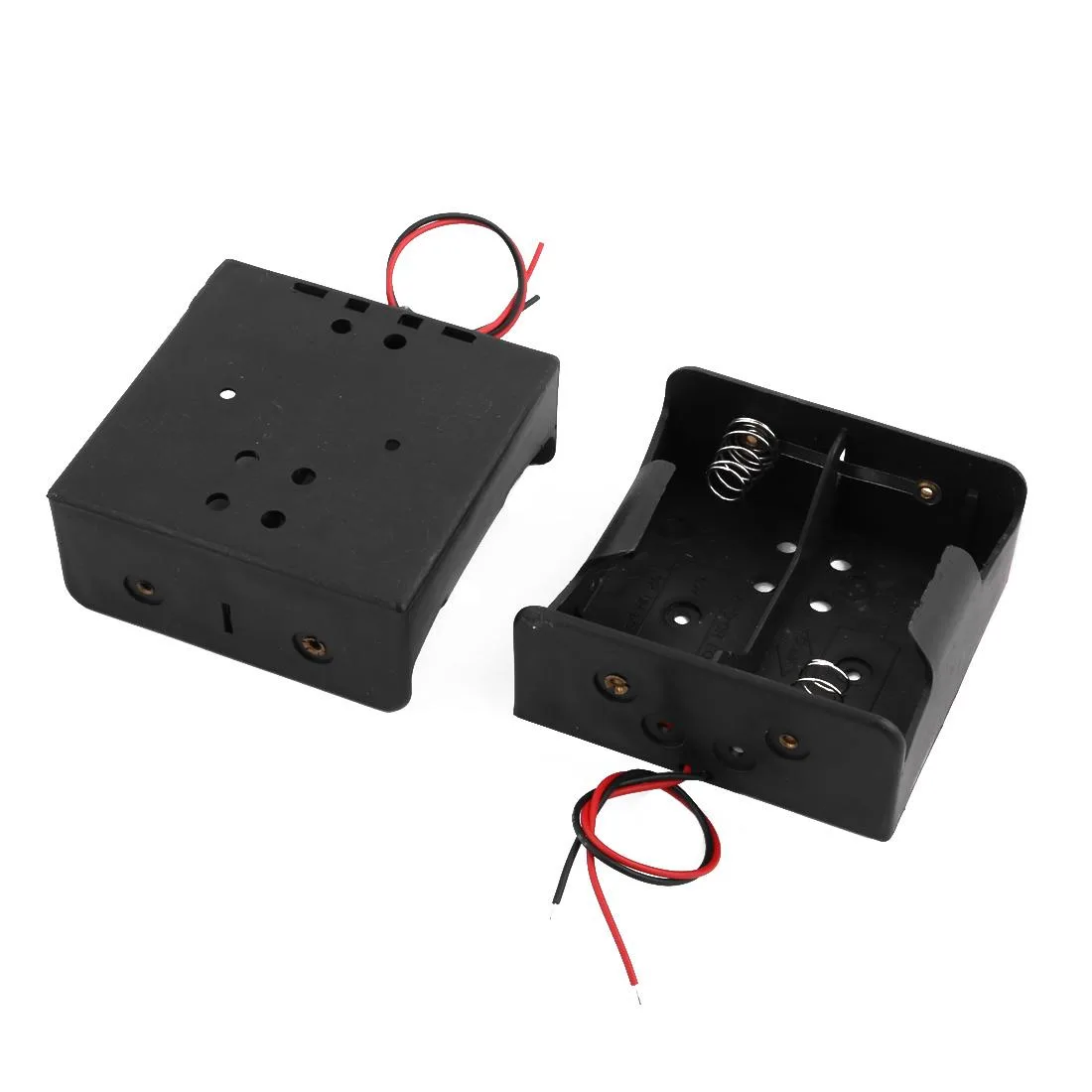 Two black plastic D battery holders side by side