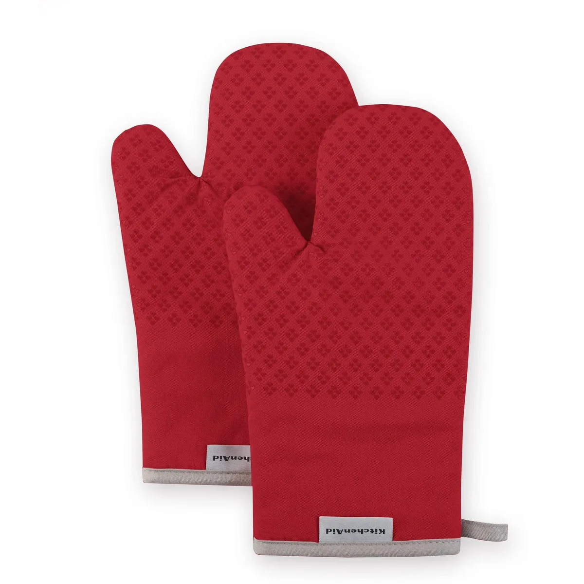 Two red cotton oven mitts with heart-shaped silicone grips, 7 by 12.5 inches
