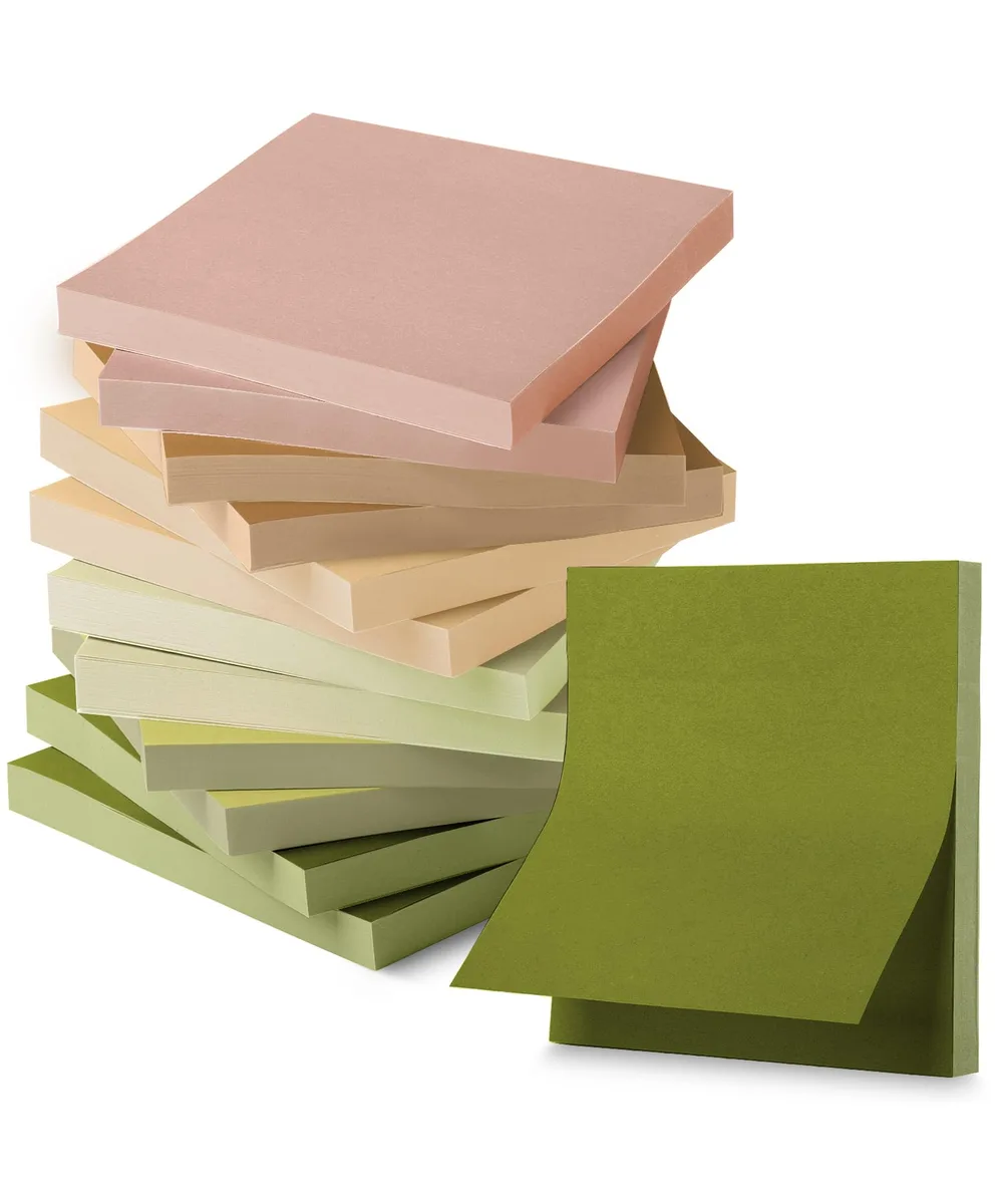 Twelve square pads of dark earthy sticky notes stacked together