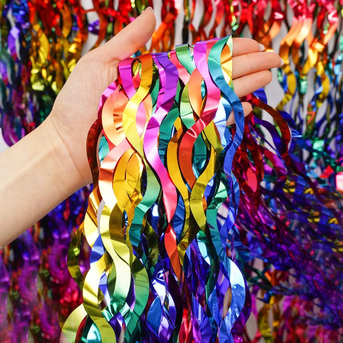 Two shiny rainbow foil fringe curtains, wavy tinsel streamers on black frames, each 40 by 60 inches