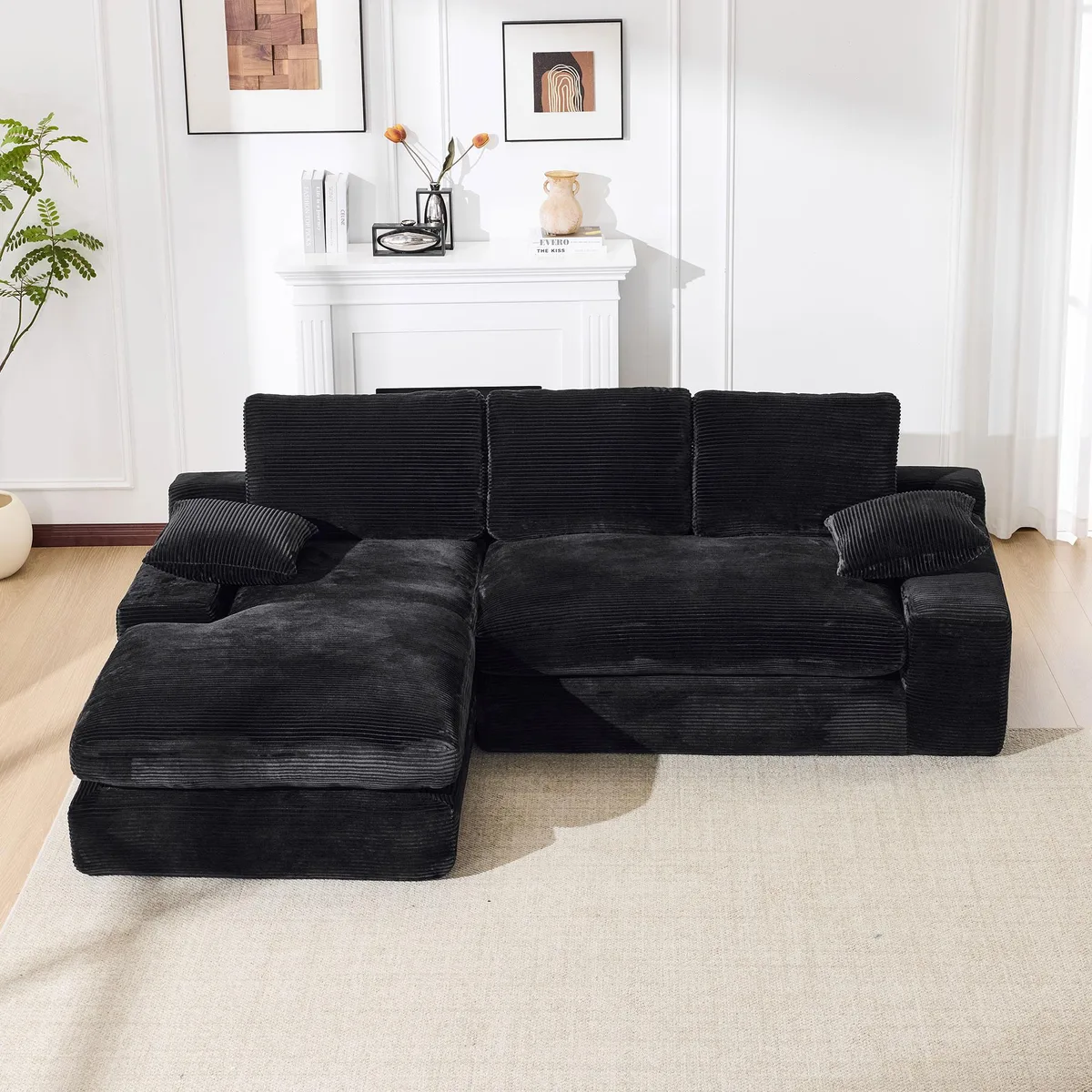 Black L-shaped modular sectional sofa with thick cushions, corduroy fabric finish, two-piece reversible design