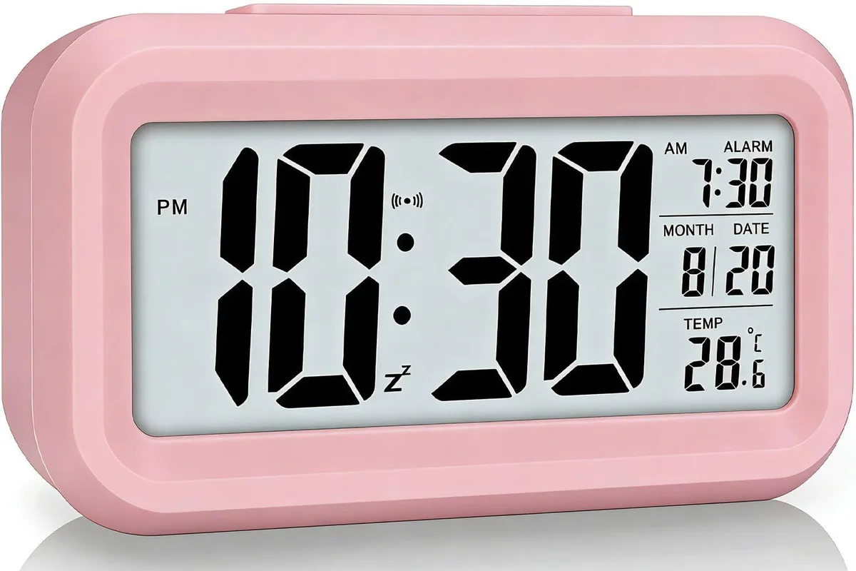 Pink rectangular digital alarm clock with large 4.5 inch LCD display showing time and temperature