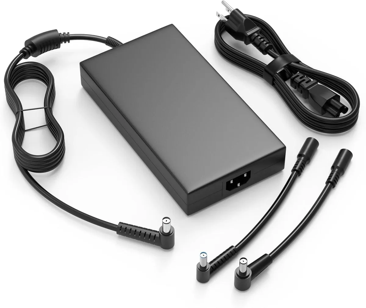 Black rectangular laptop charger with detachable power cord and three interchangeable barrel tips