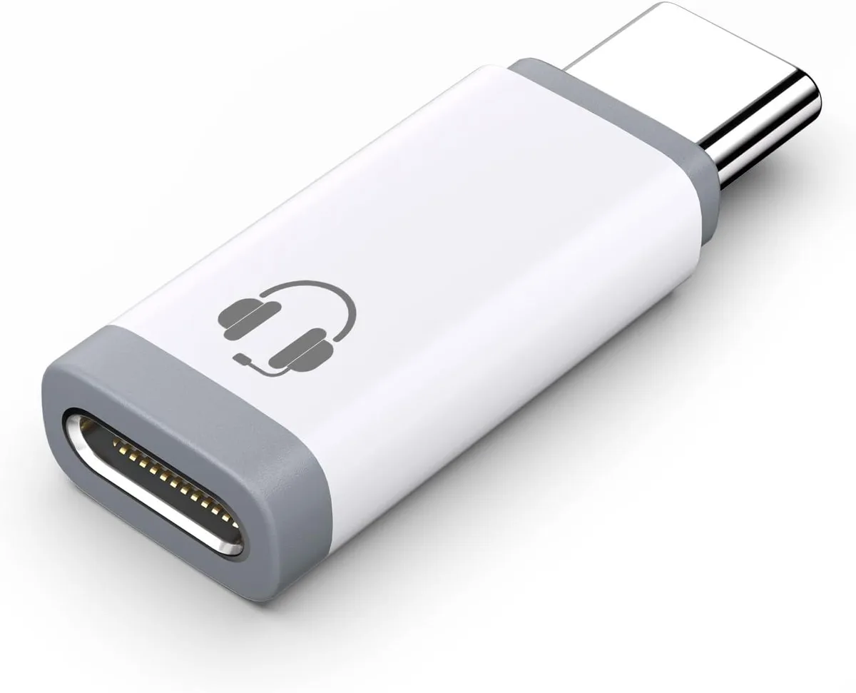 Two white USB-C to Lightning audio adapters, compact male-to-female dongles