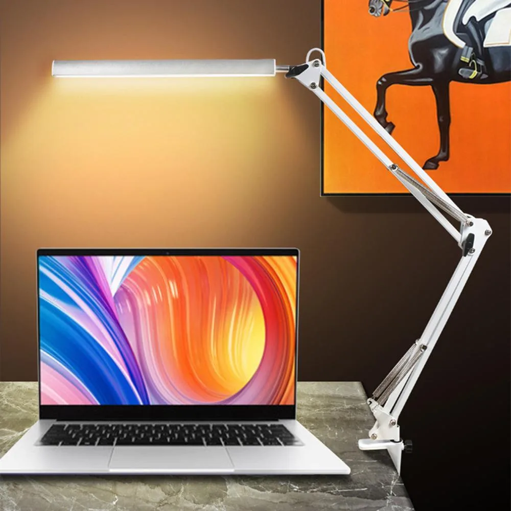 White adjustable swing-arm desk lamp with metal clamp base
