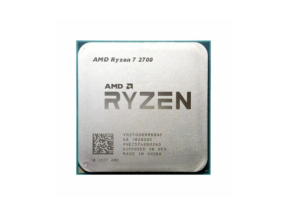 Square green ceramic processor with gold contacts and silver metal heatspreader engraved with Ryzen 7 2700
