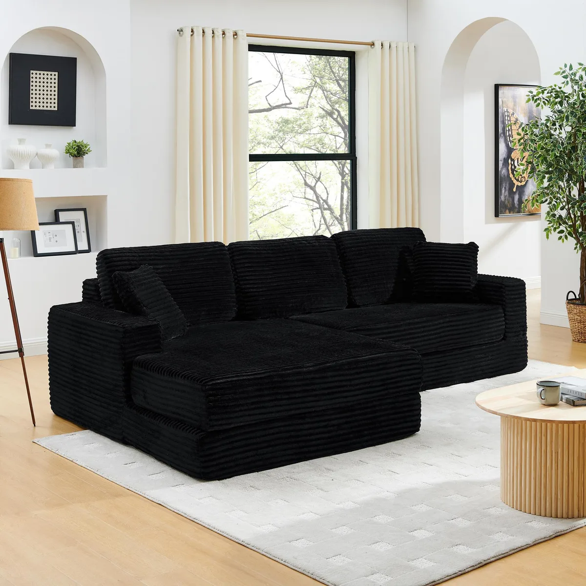Black corduroy left-seat modular sectional with clean lines