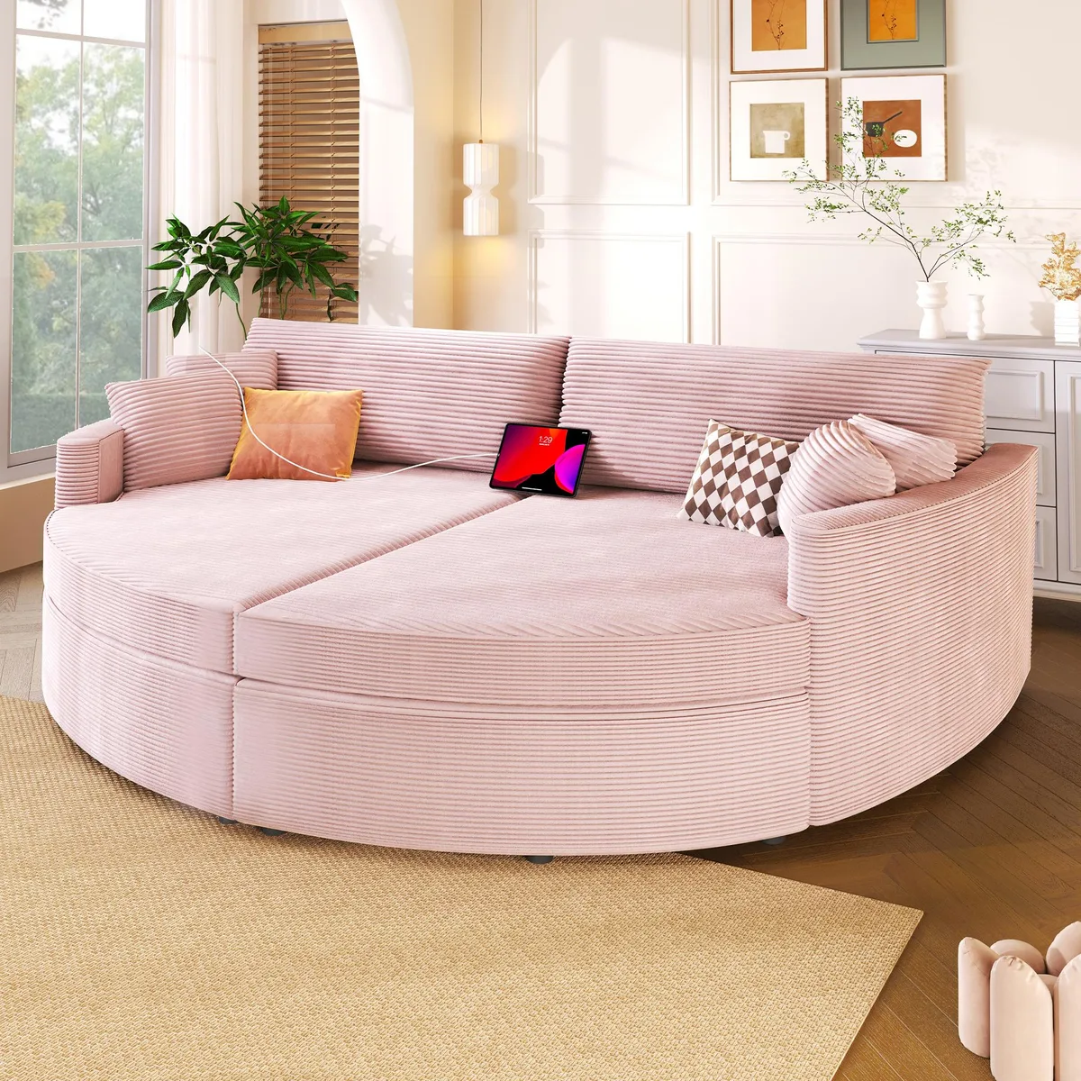 Oversized pink corduroy double chaise lounge sofa with rounded silhouette and deep seat