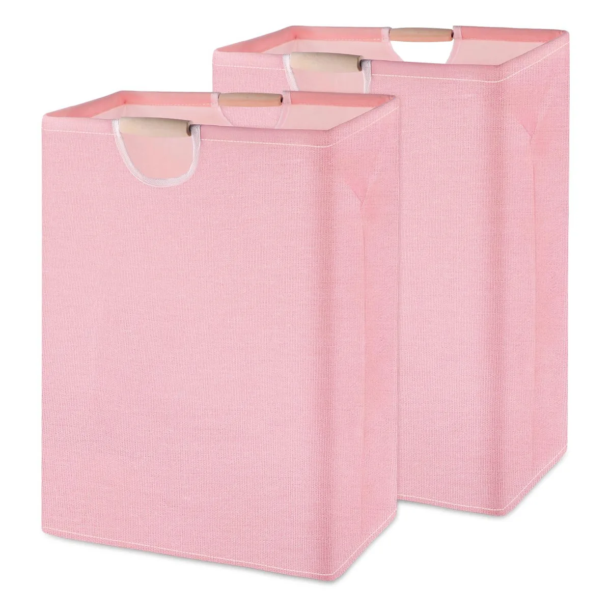 Two pink foldable laundry hampers with bamboo handles standing side by side