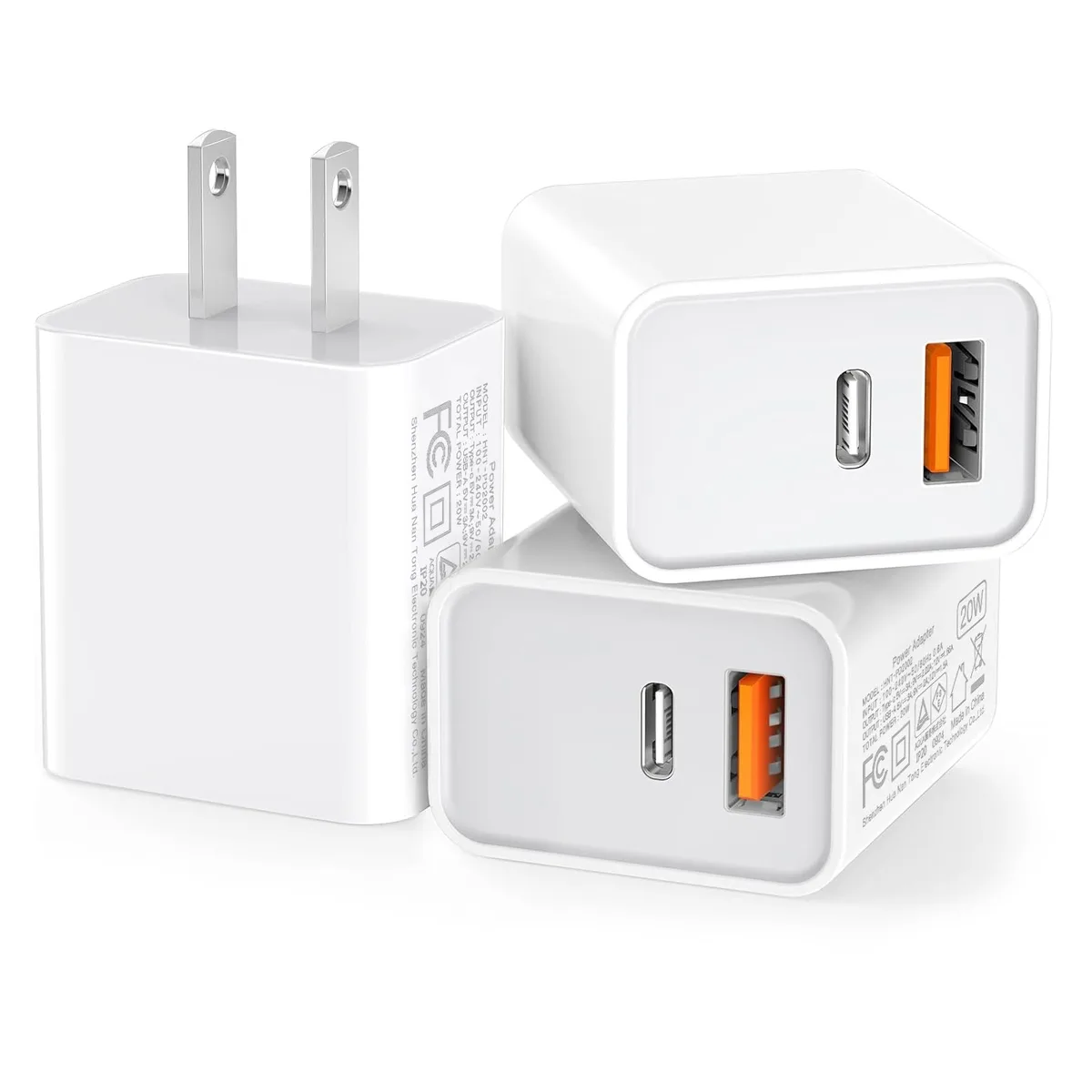 Three white dual-port USB-C wall chargers shown together