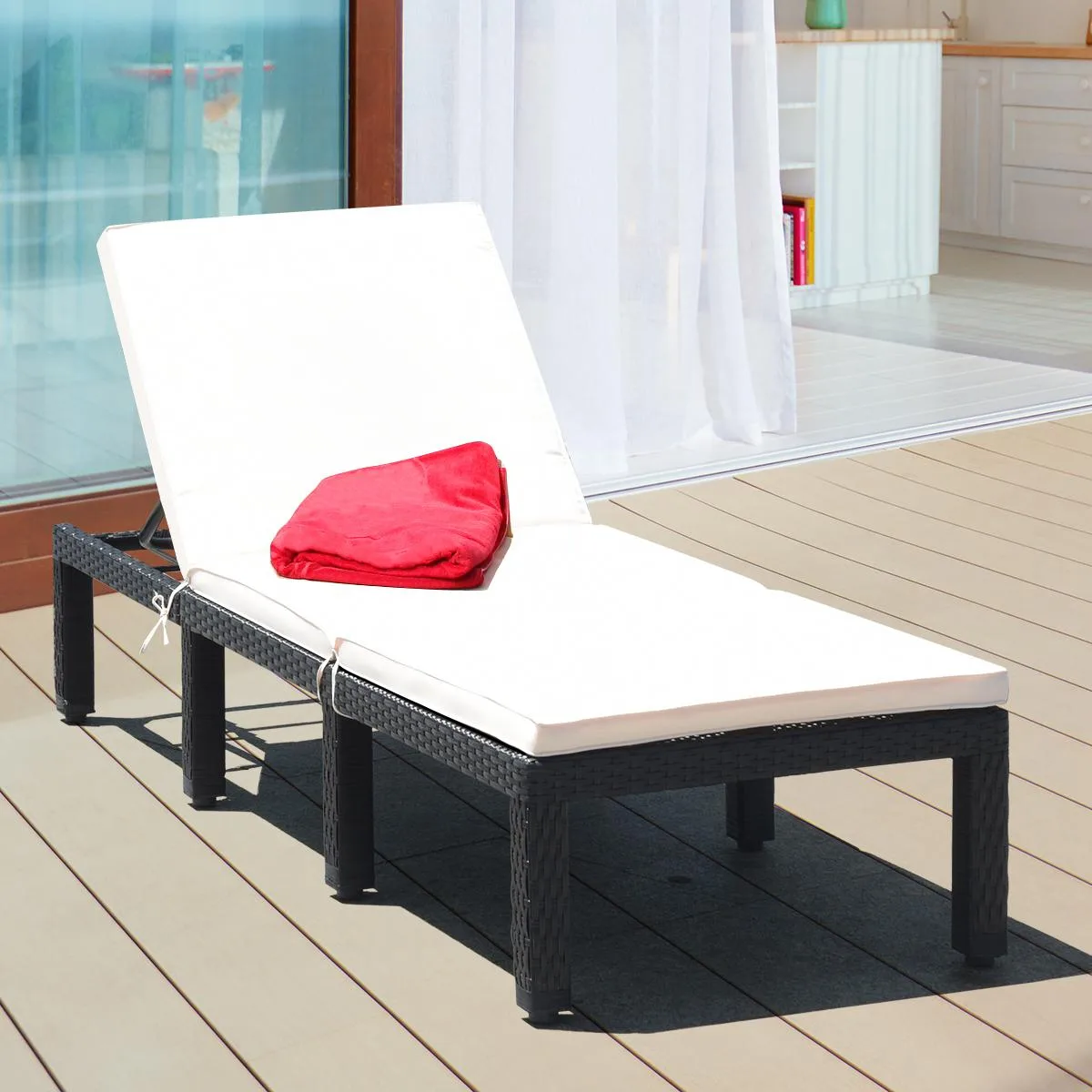White rattan lounge chair with adjustable backrest and thick cushion