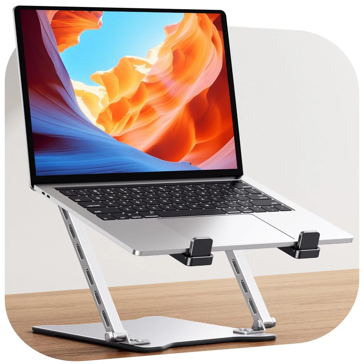 Silver foldable laptop stand, dual-bar design, slim profile, adjustable height and tilt