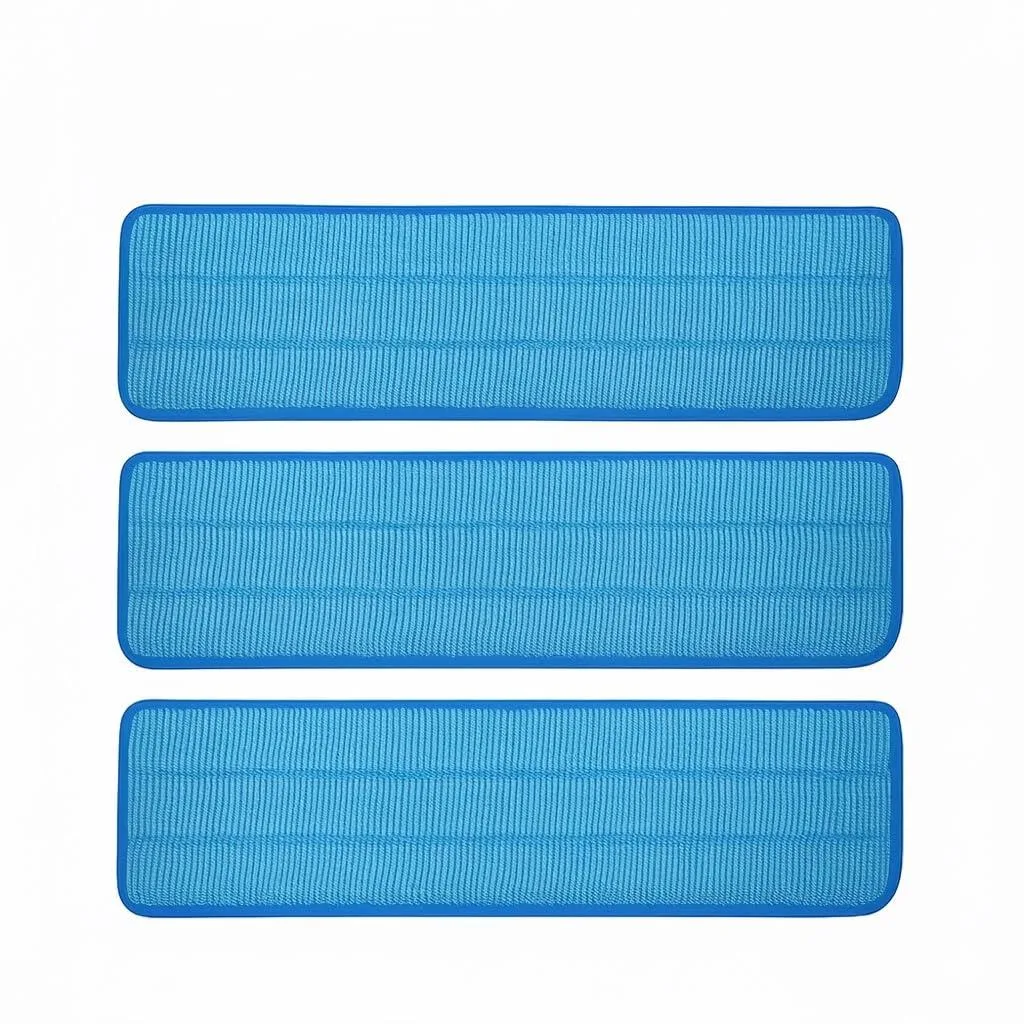Three white 18-inch microfiber mop pads with hook-and-loop backing