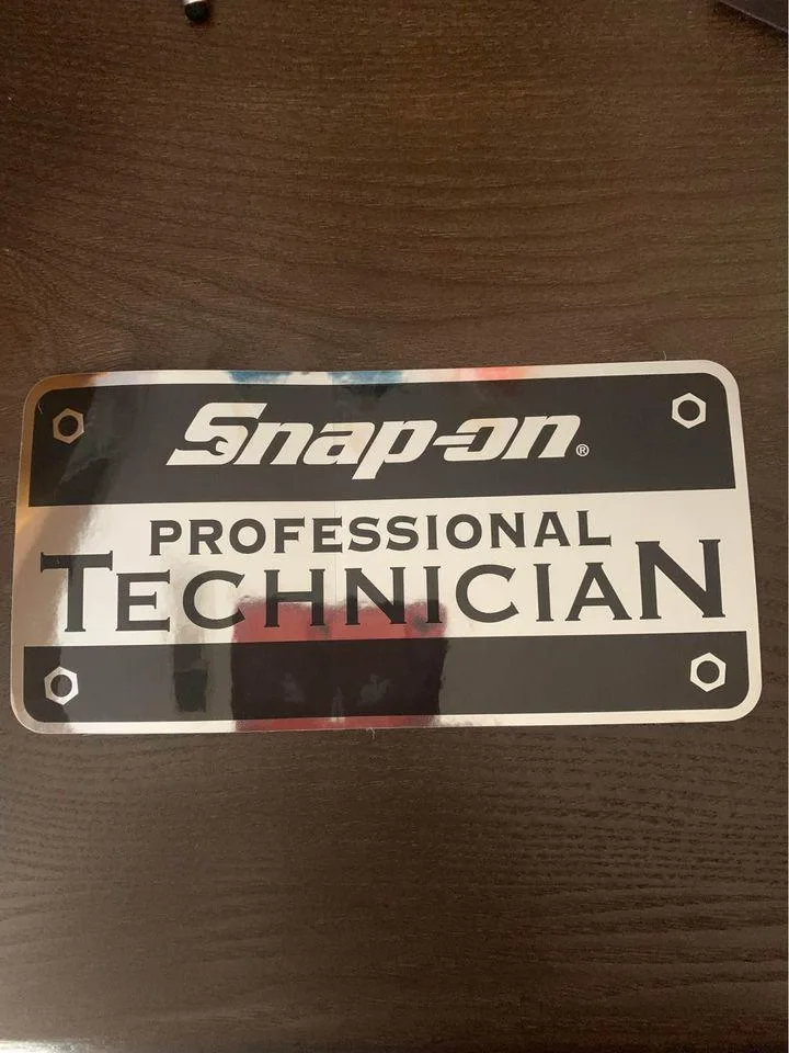 Rectangular black and chrome Snap-On sticker, 7 1/4 by 3 1/2 inches