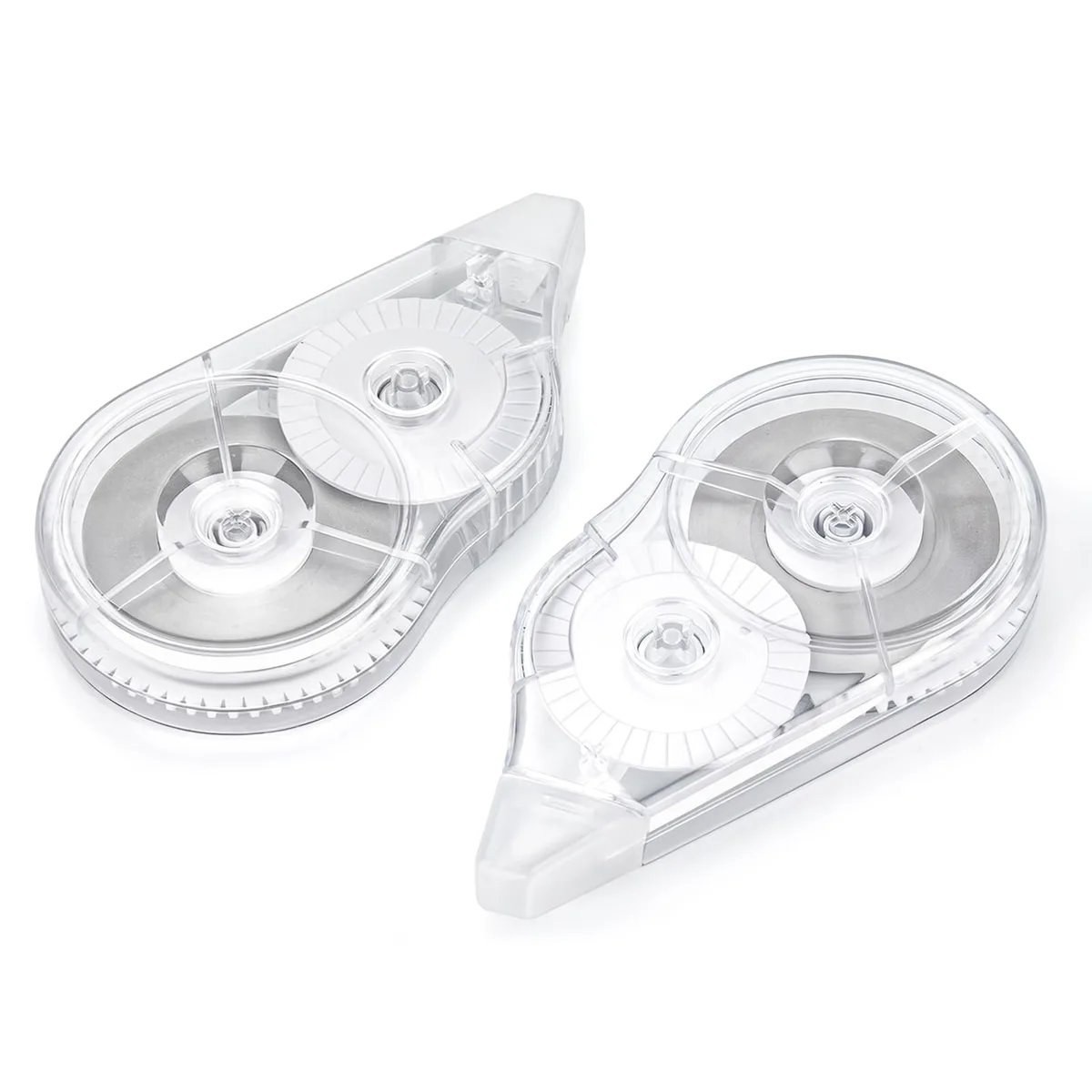Two white correction tape dispensers in black matte plastic with clear bodies
