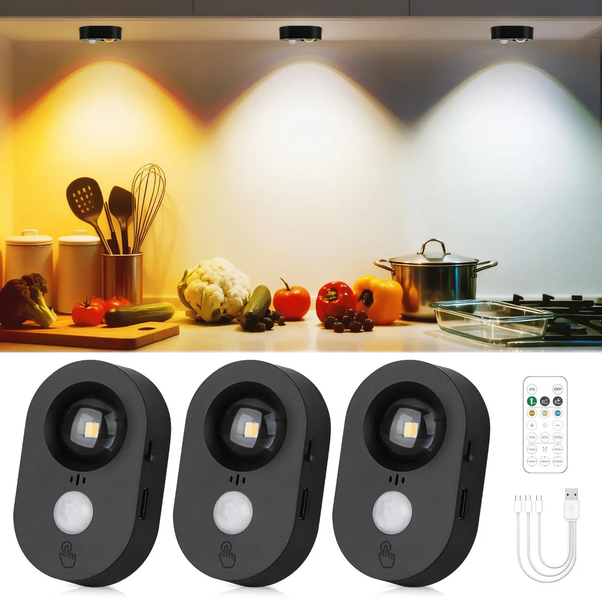 Three small round white puck lights with a remote control
