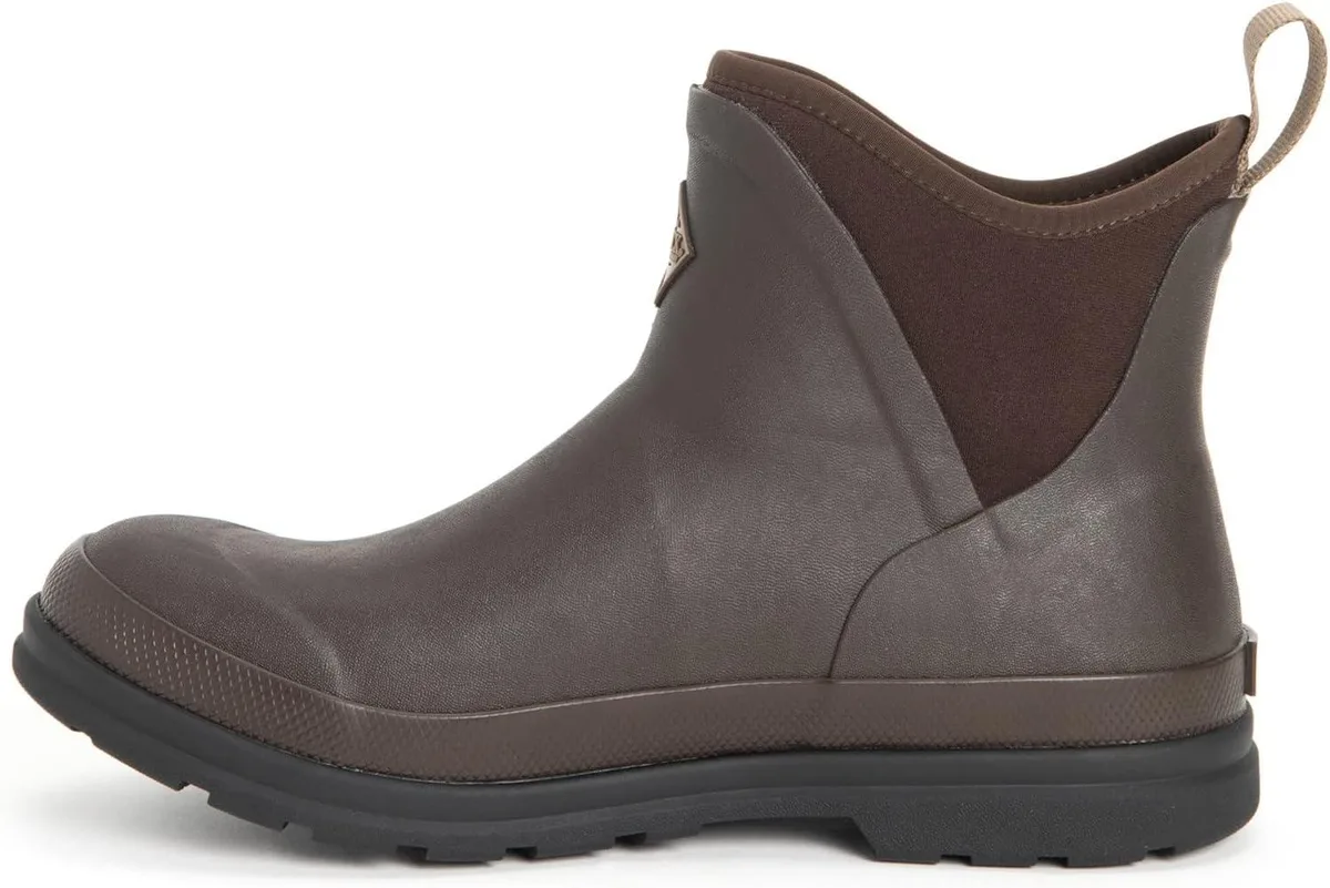 Brown ankle boot with soft rubber exterior and exposed neoprene sides