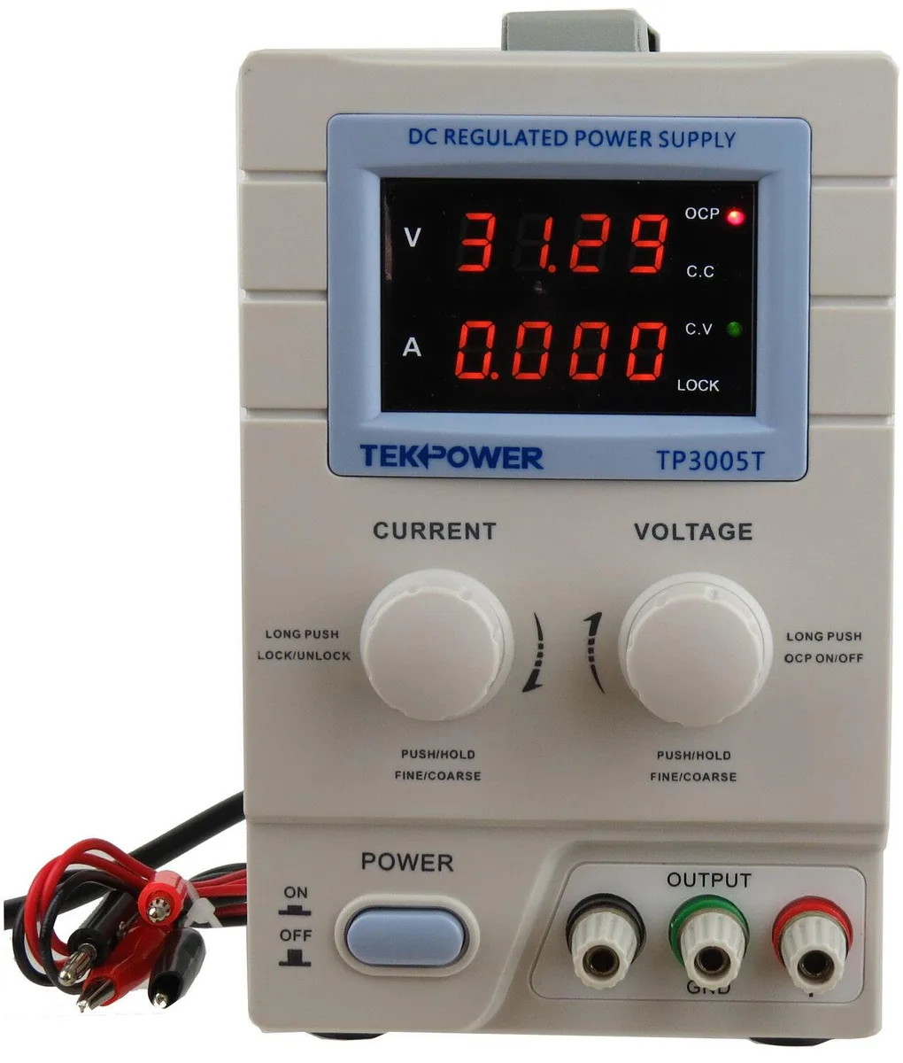 Rectangular beige bench power supply with digital display and rotary knobs