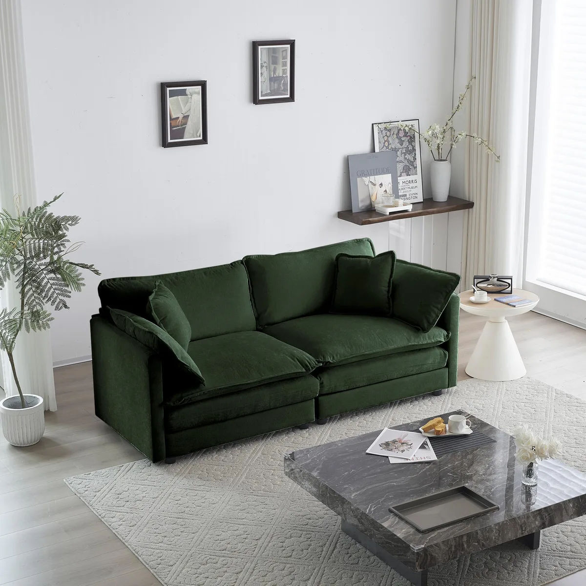 Green chenille two-seat loveseat with four matching pillows, low profile, deep seat, solid wood frame visible at legs