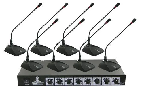 Black rack-mount receiver with dual antennas, eight tabletop wireless microphones