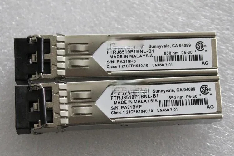 Small rectangular SFP transceiver module with metallic finish and side label