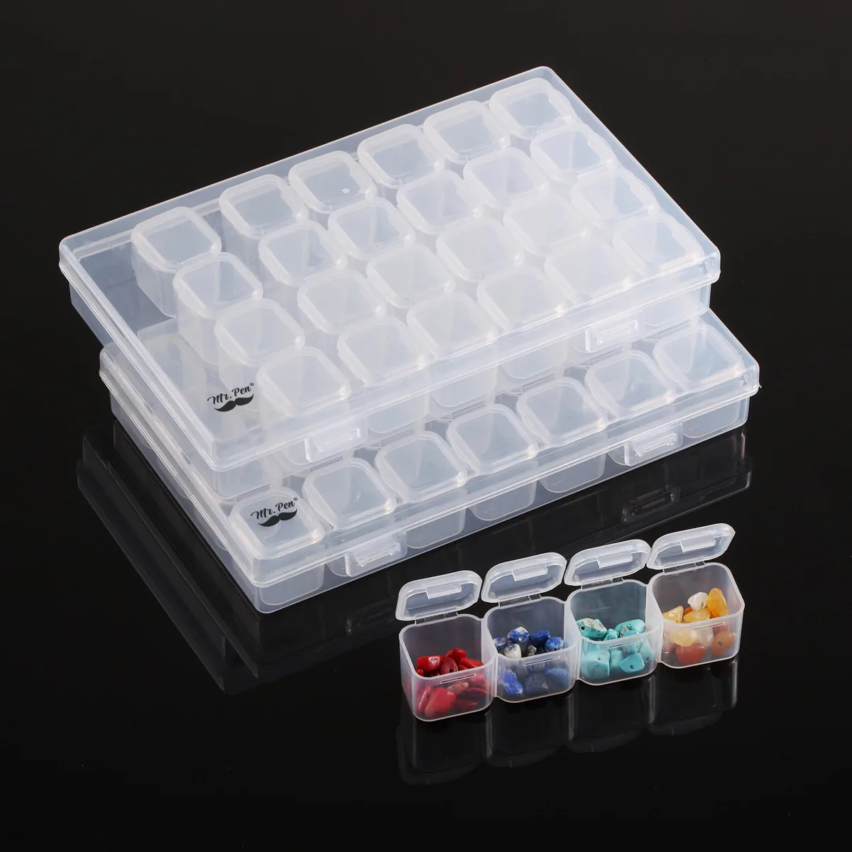 Two clear plastic boxes each holding twenty-eight small compartments with snap lids