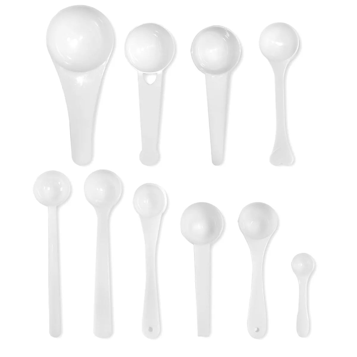 White plastic measuring spoon set, ten nested pieces, smooth matte finish