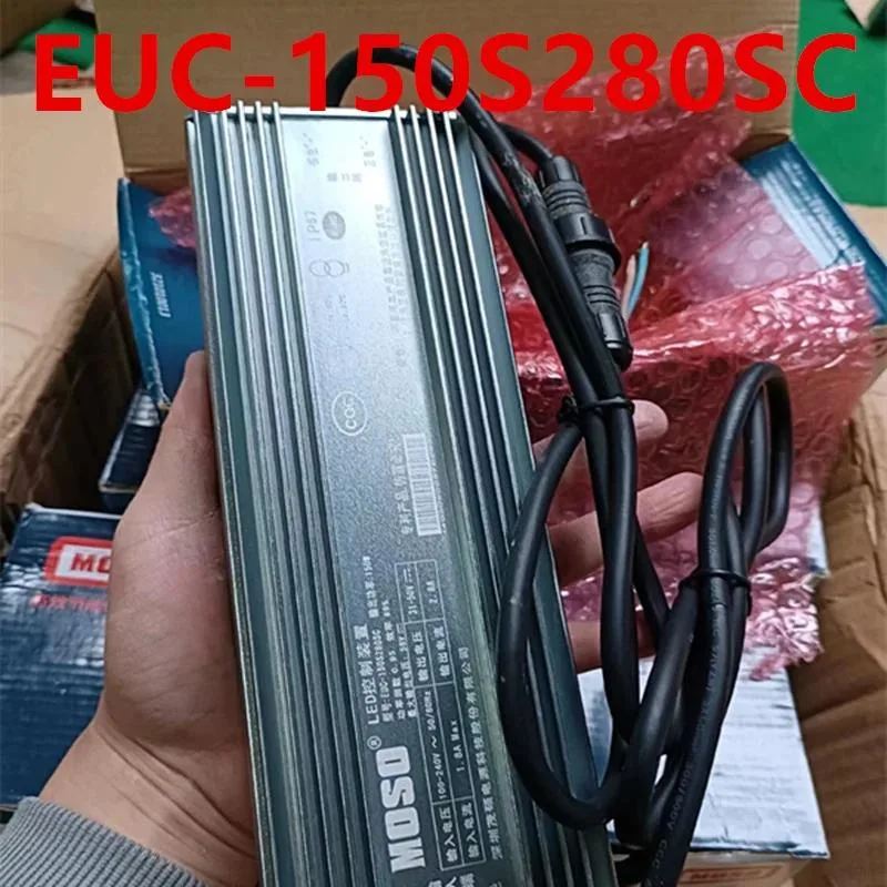 Silver rectangular ATX power supply unit with black cooling fan grille and side label