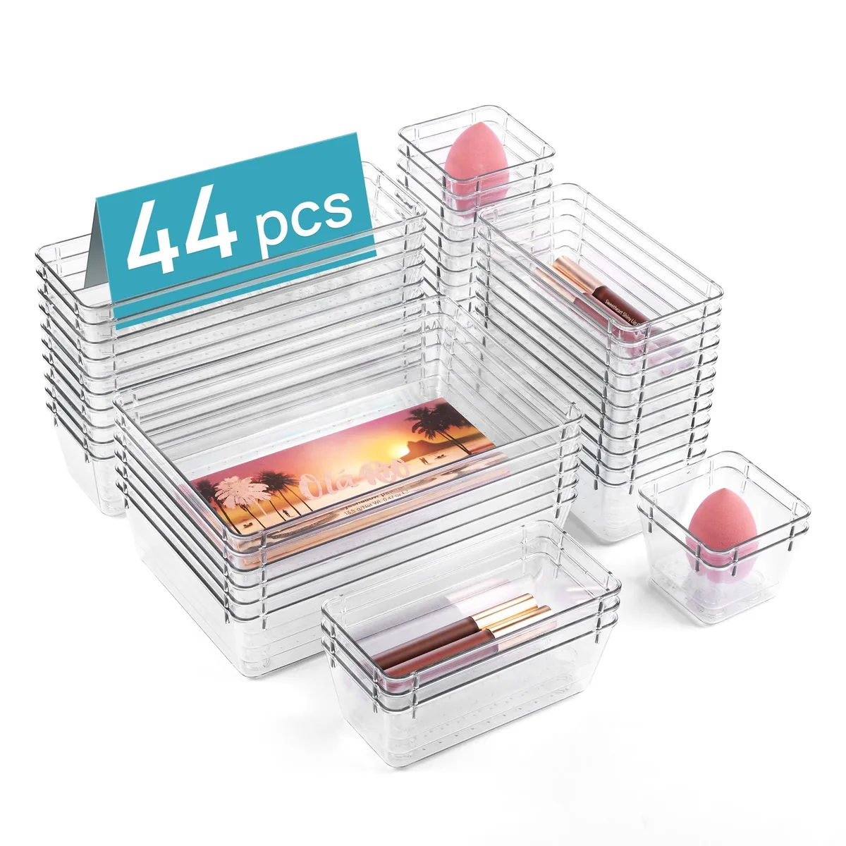 Clear plastic organiser trays in four rectangular sizes, polished chrome finish, stacked together
