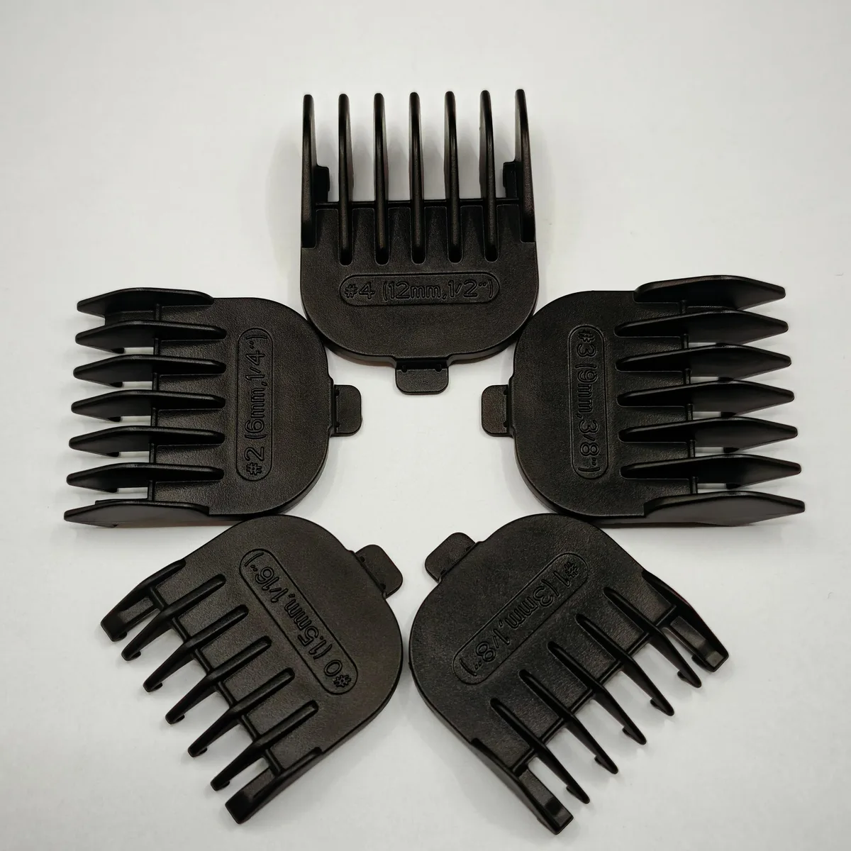 Five black guide combs in sizes 1.5 3 6 9 12 mm