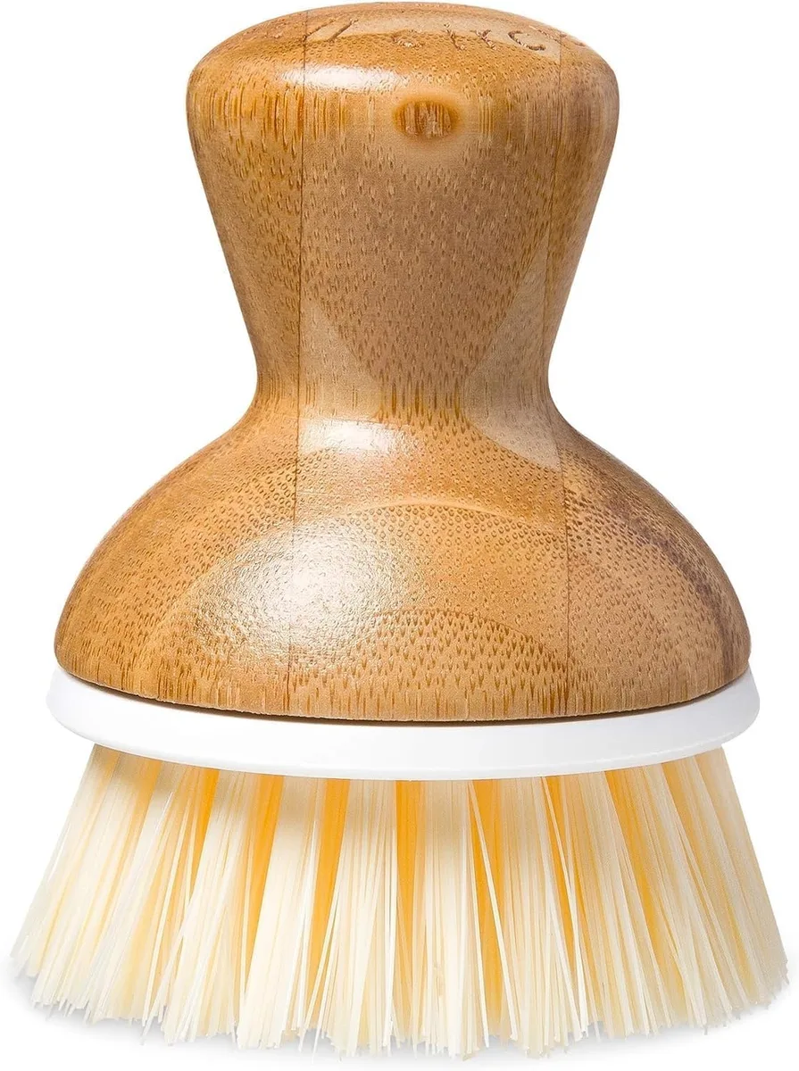 White dish scrub brush with ergonomic handle and bristled head