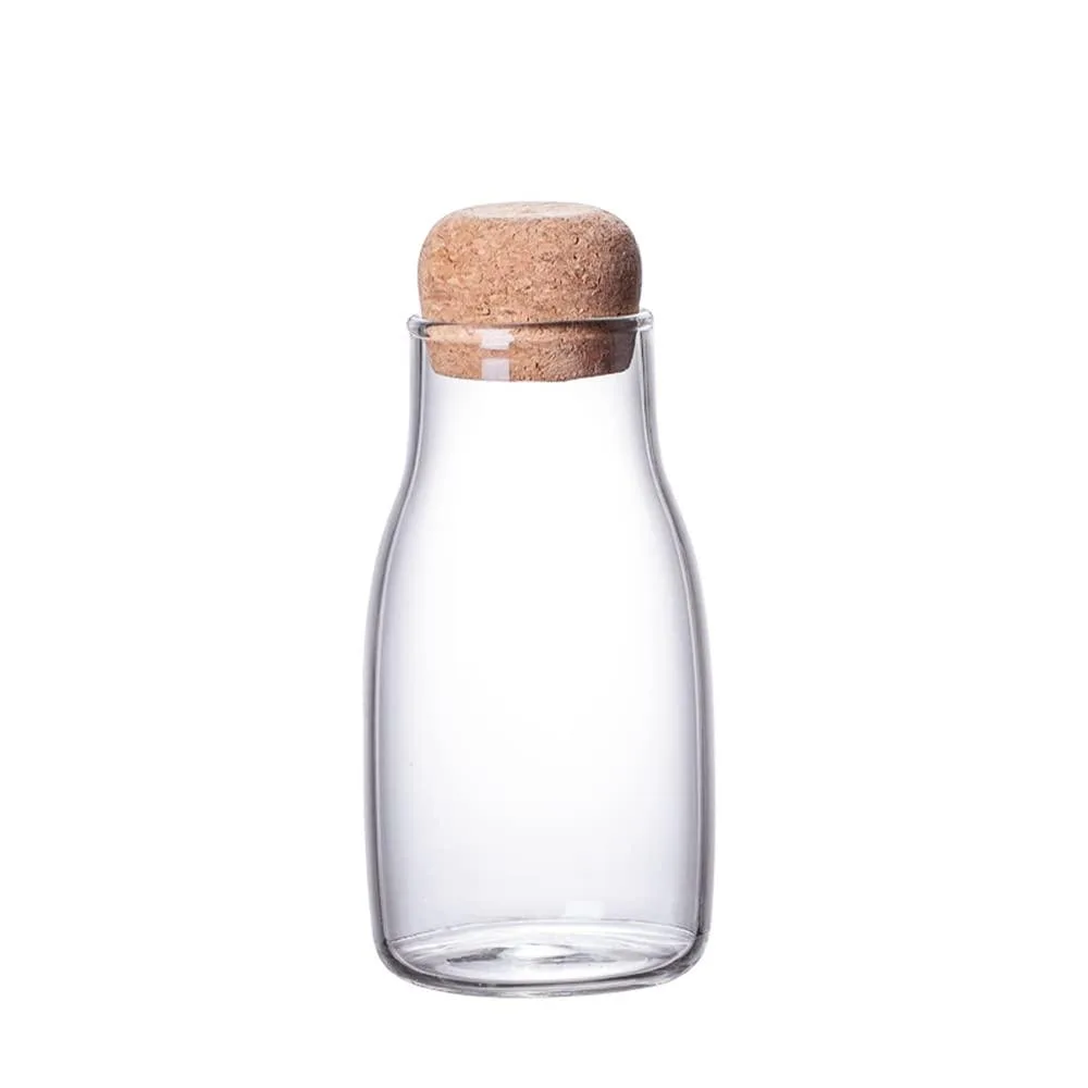 Clear glass jar with cork lid, 2 by 2 by 4.9 inches