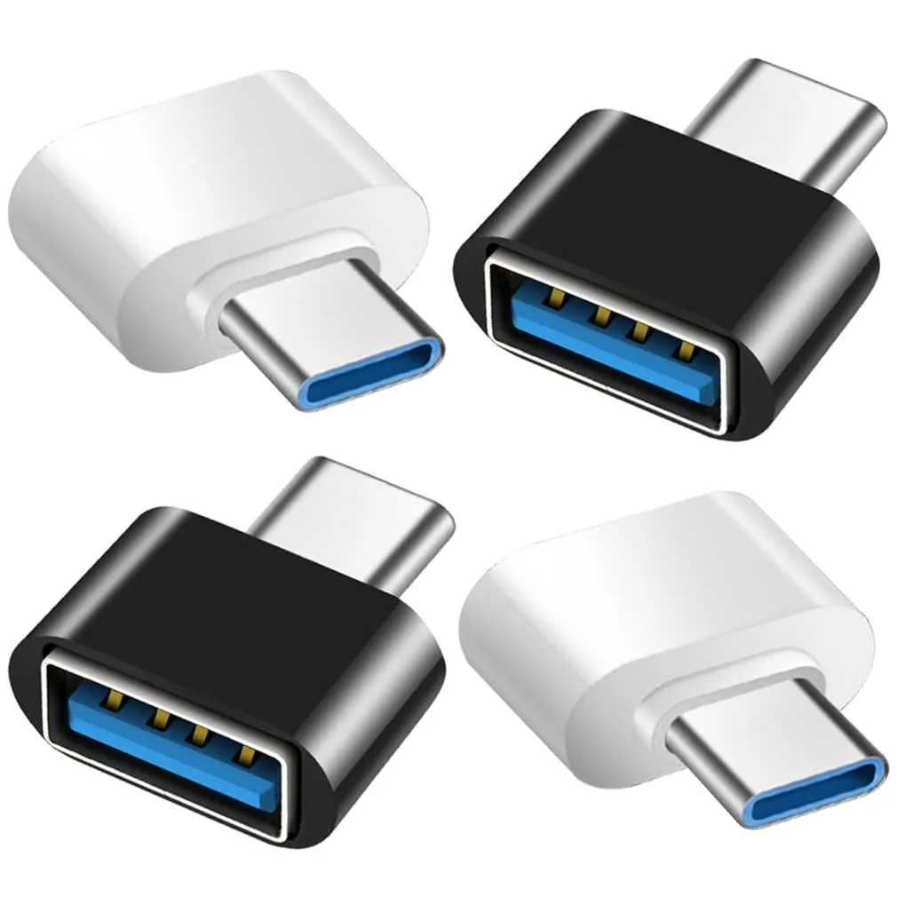 Four tiny USB-C to USB-A adapters, two black and two white, plastic bodies, compact and lightweight