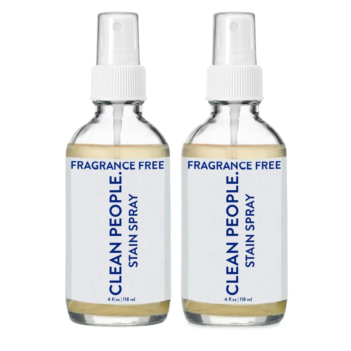 Two clear glass spray bottles with white caps and minimalist labels on a light surface