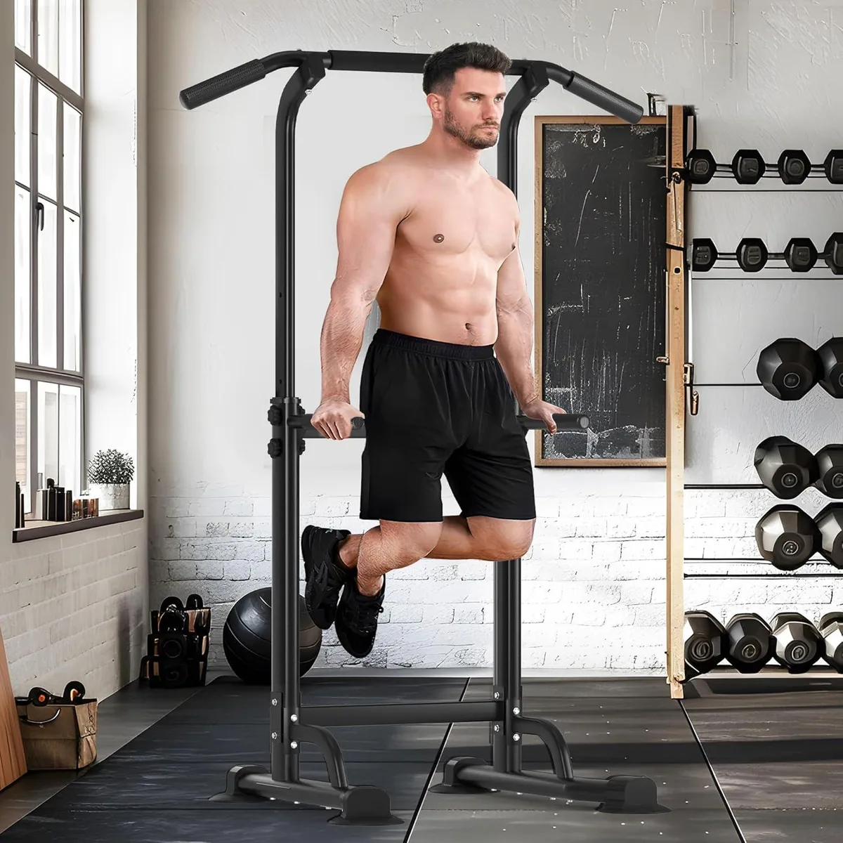 Freestanding steel power tower with adjustable pull-up bar and dip handles, splayed base, grey finish