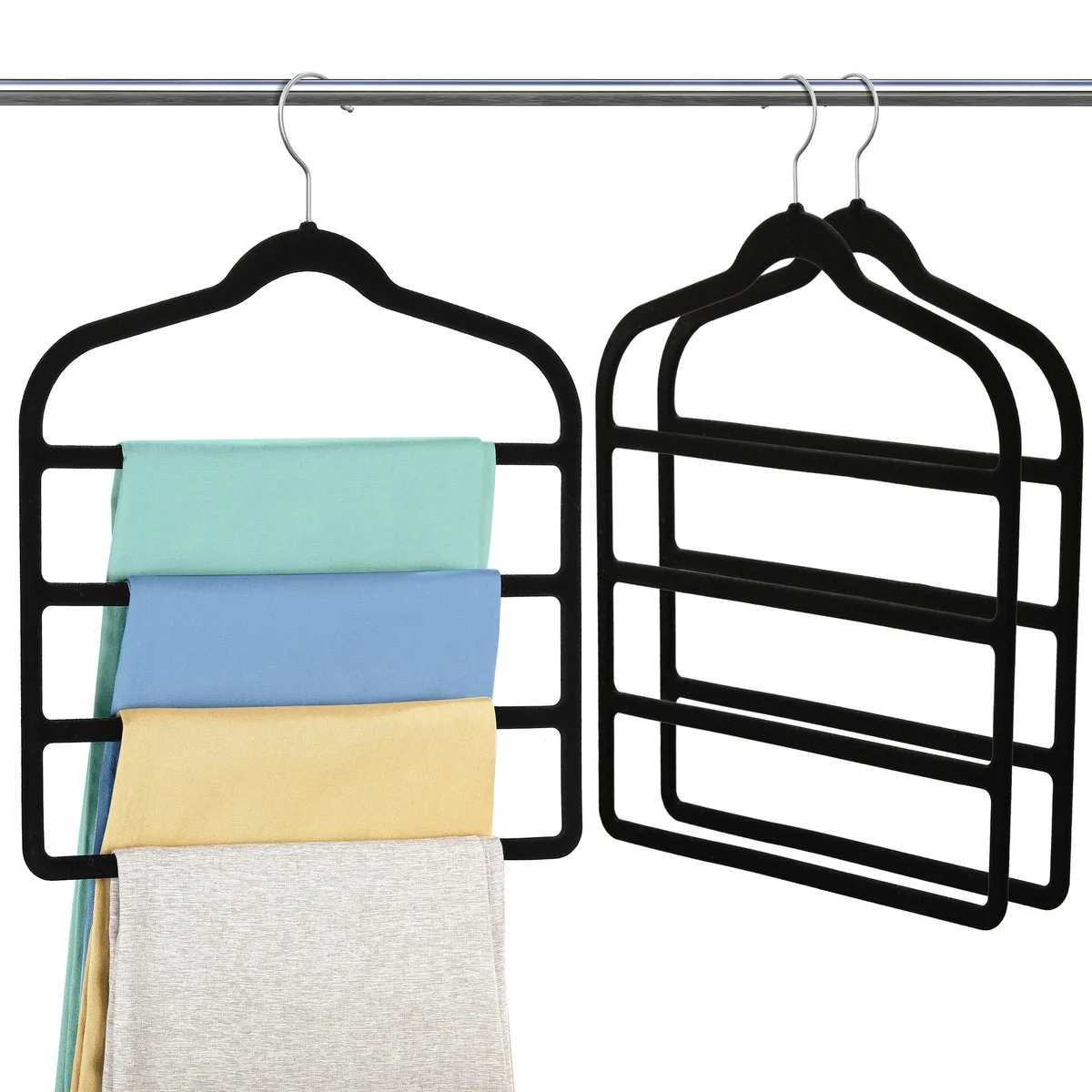 Three black velvet four-tier pant hangers with swivel hooks