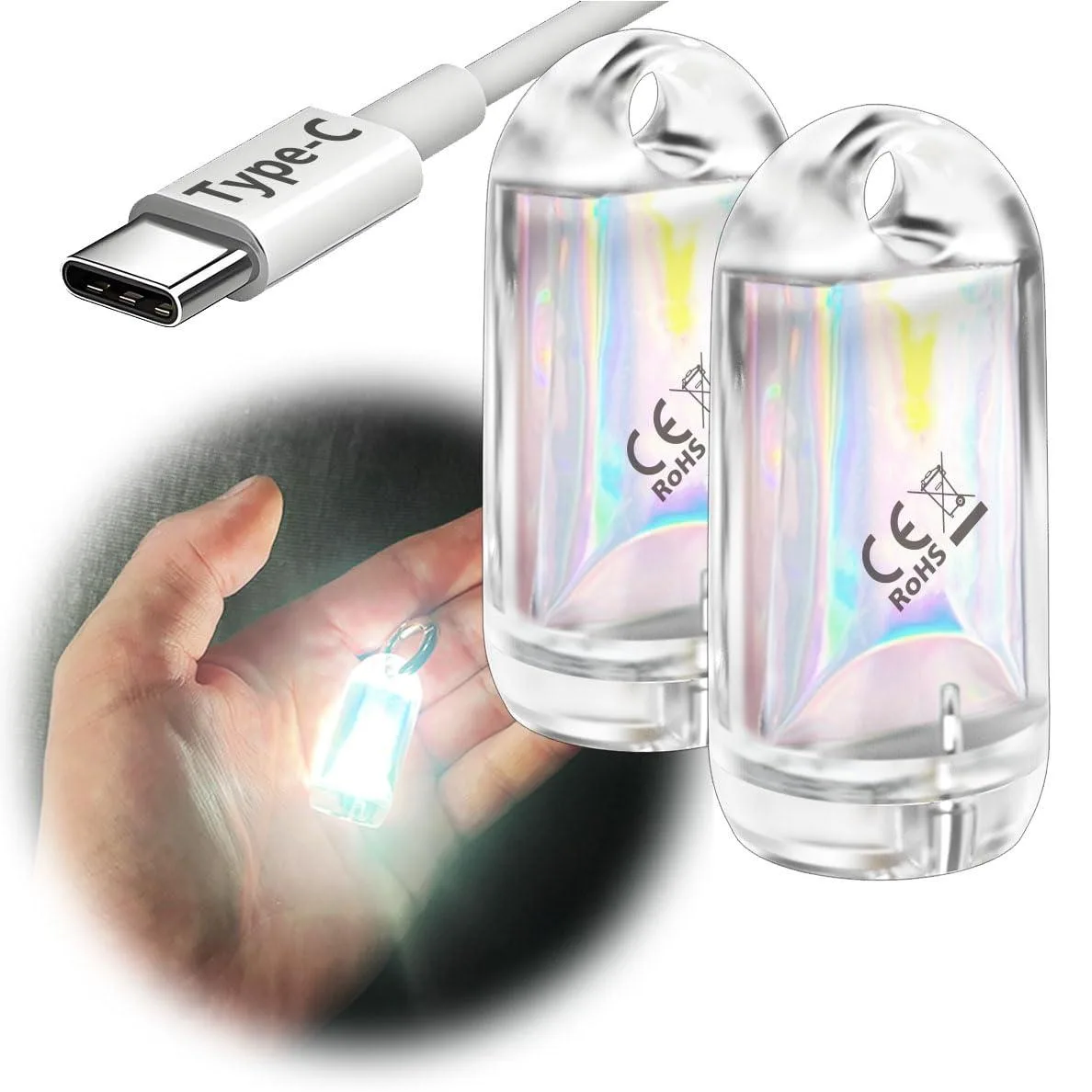 Two tiny black cylindrical lights on a key ring, matte finish, each about the size of a thumbnail
