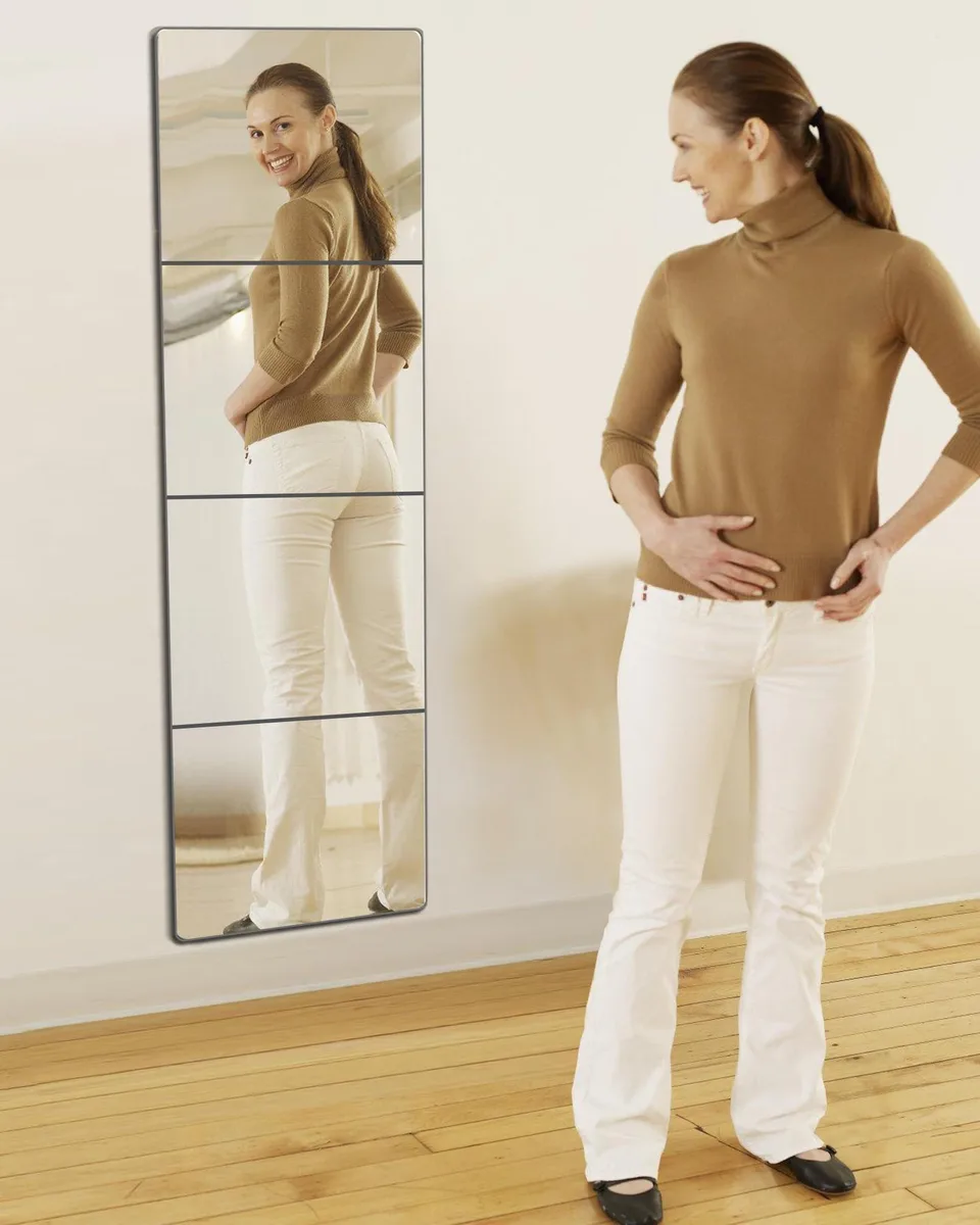 Four square acrylic mirror tiles with clear finish and self-adhesive backing