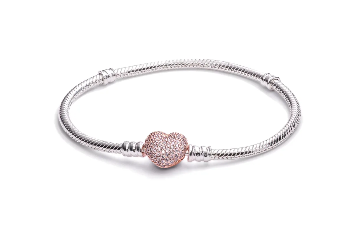 Sterling silver bracelet with rose gold heart clasp set with clear stones