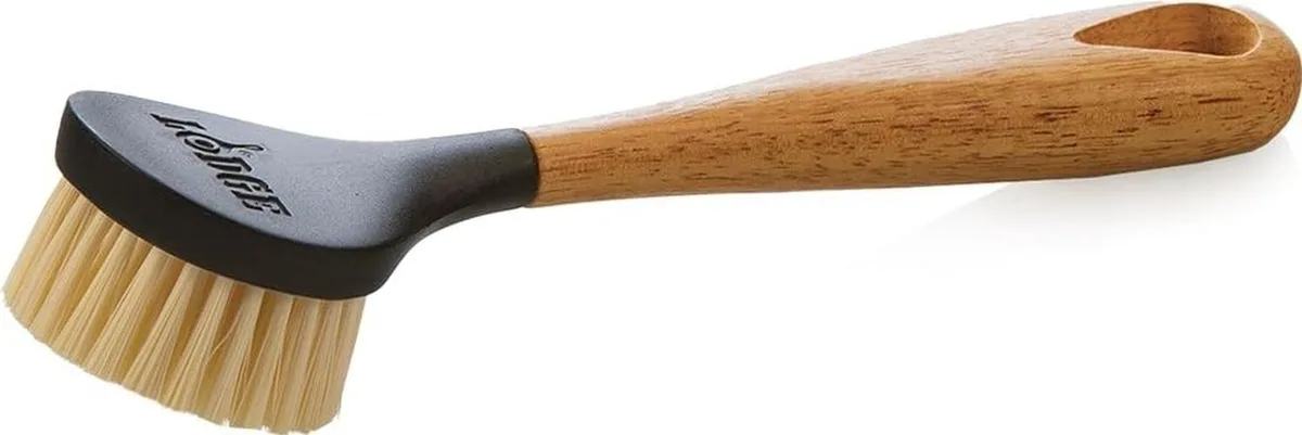 Lodge 10 inch cast iron scrub brush with ergonomic handle and stiff bristles