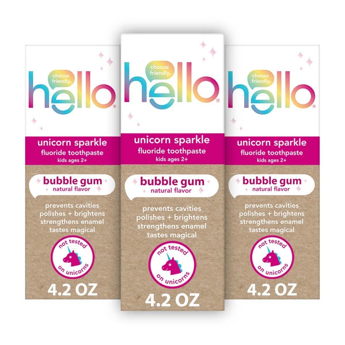 Three white 4.2 oz toothpaste tubes with unicorn graphics