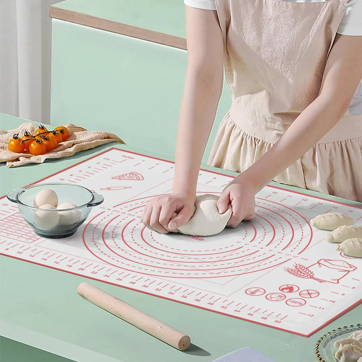 Rectangular silicone baking mat with checkered pattern and measurement markings, 16 by 24 inches