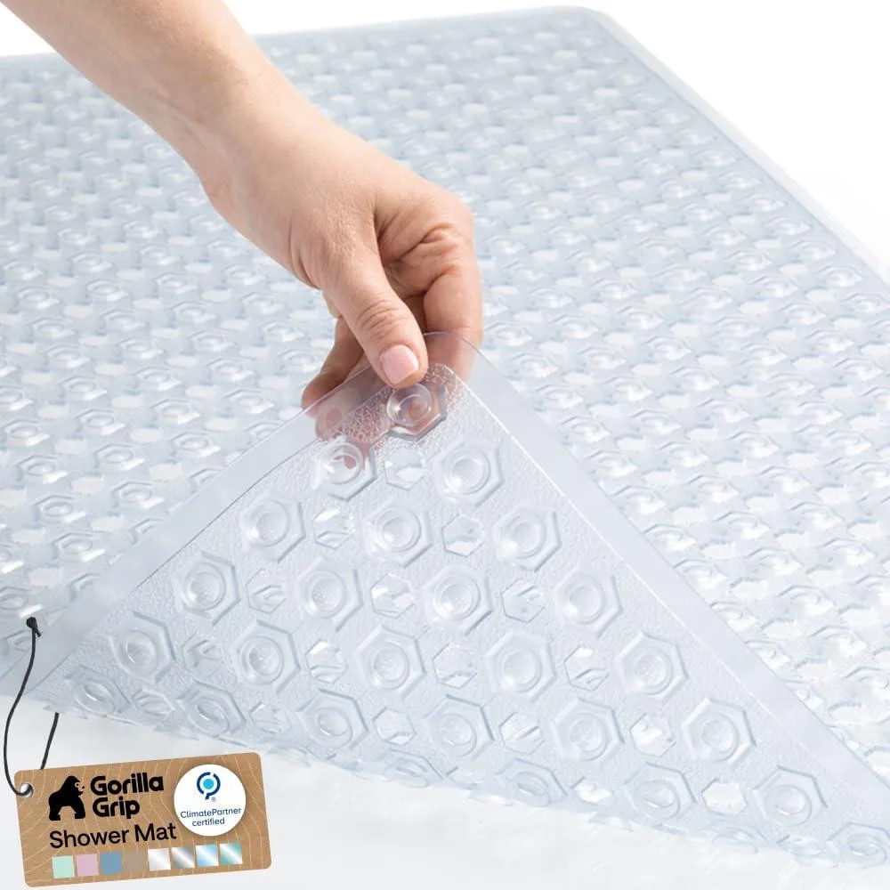 Clear rectangular bath mat with suction cups and drainage holes, 35 by 16 inches