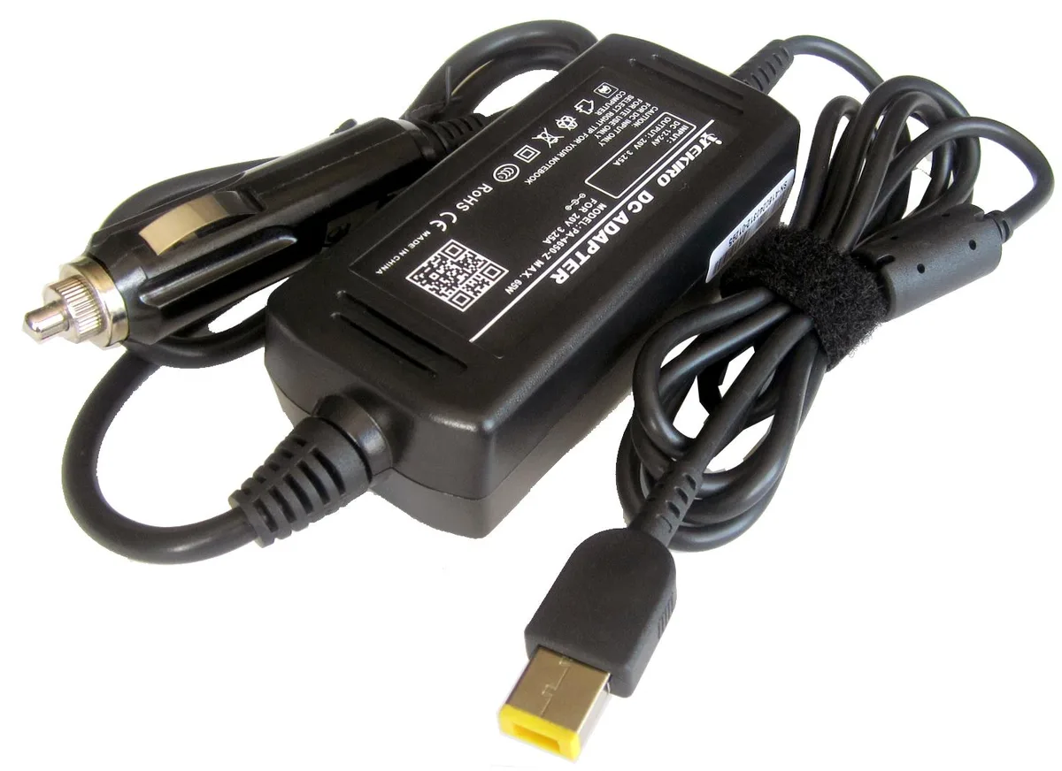 Compact black car charger with long coiled cable and LED indicator