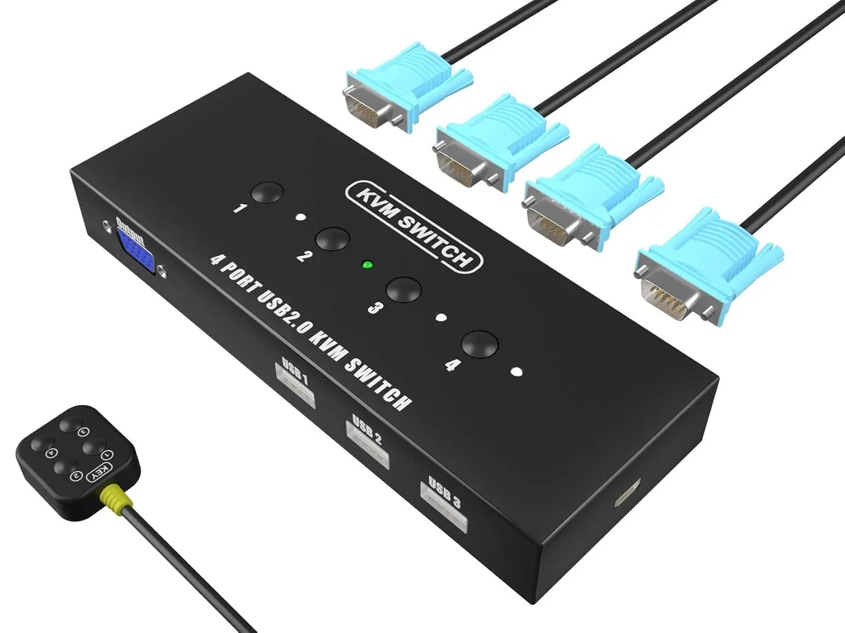 Black rectangular KVM switch unit with front buttons and rear VGA USB ports plus small wired desktop controller