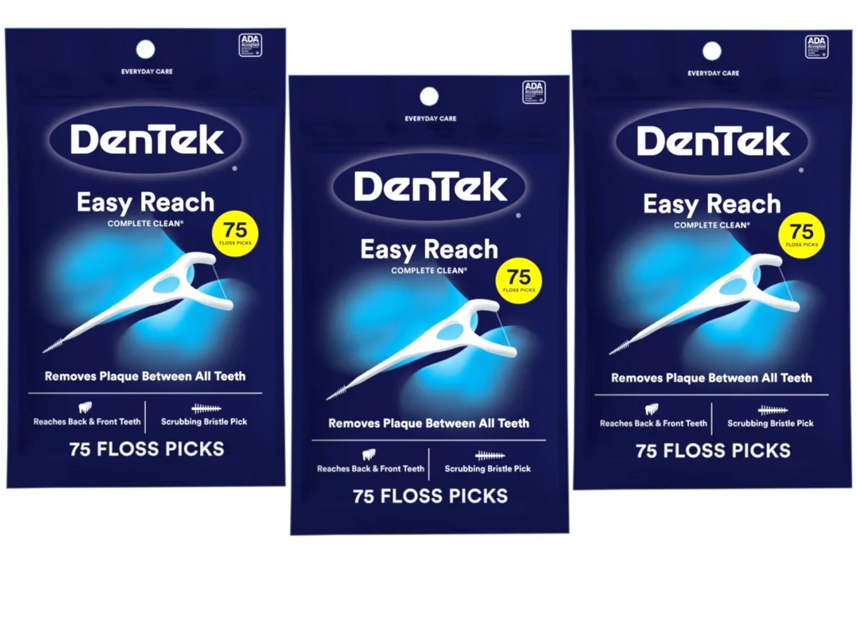 Three rectangular boxes of mint floss picks with Y-shaped handles and flexible bristle tips