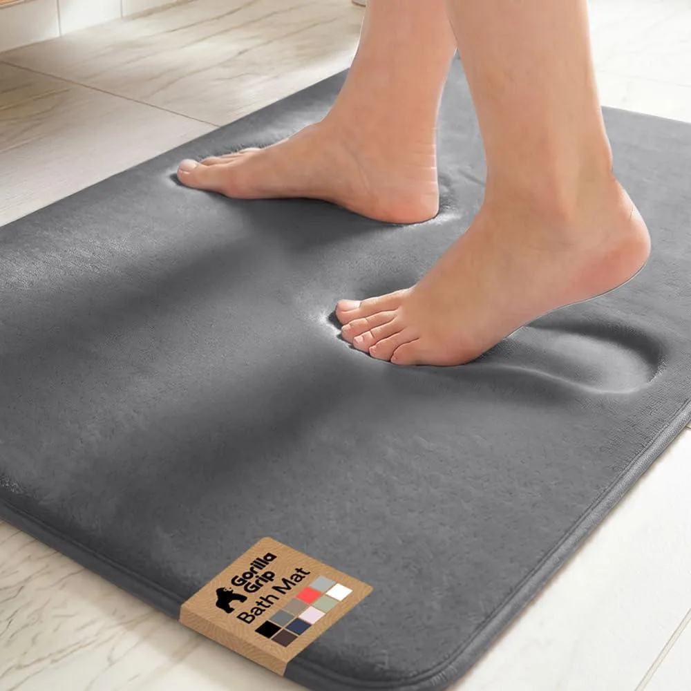 Rectangular graphite gray bath mat with plush velvet top and dotted rubber backing