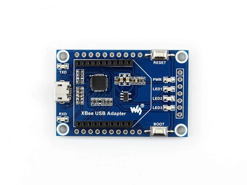 Small green circuit board with USB connector and XBee socket, CP2102 chip visible