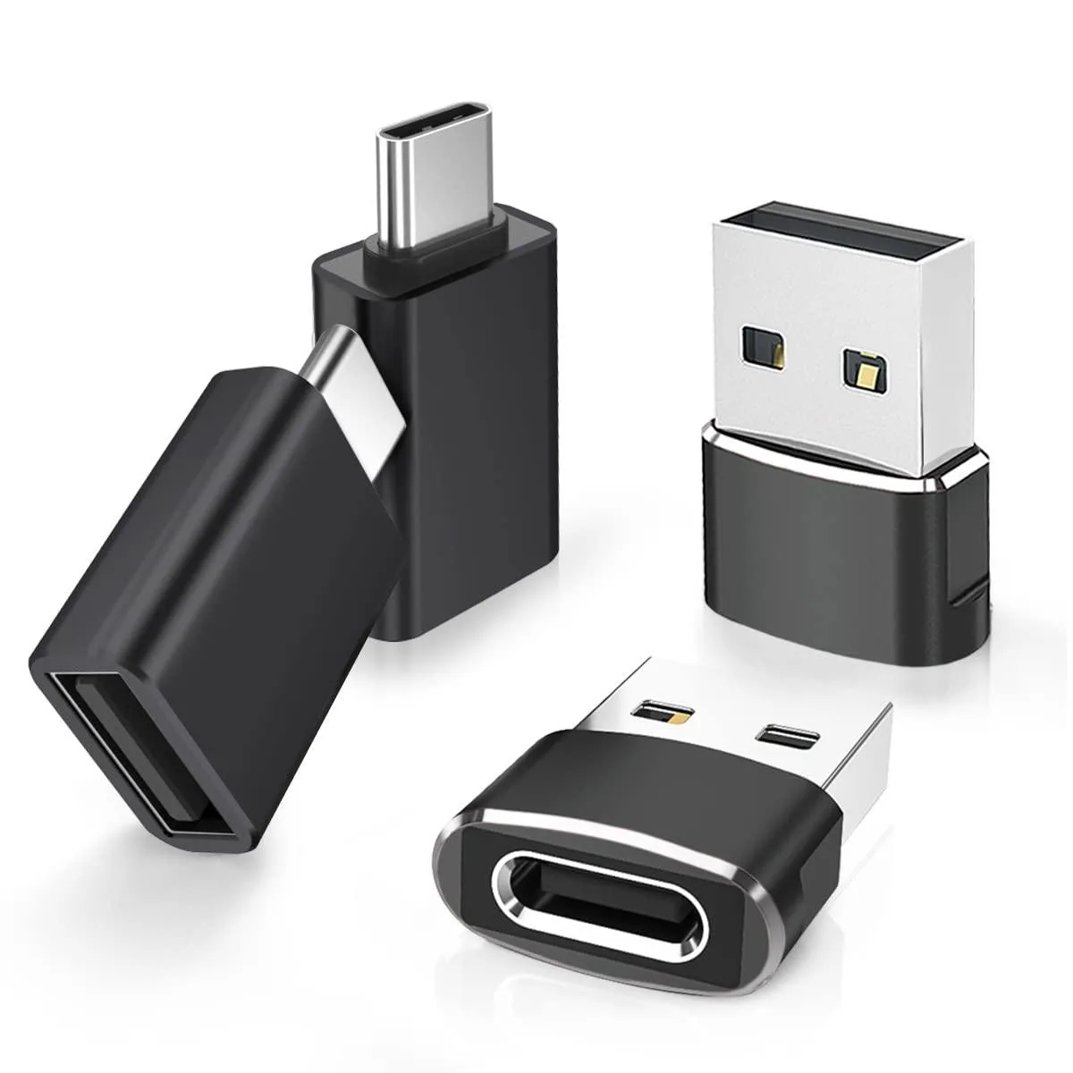 Four small black USB adapters, two with USB-C plugs and two with USB-A plugs