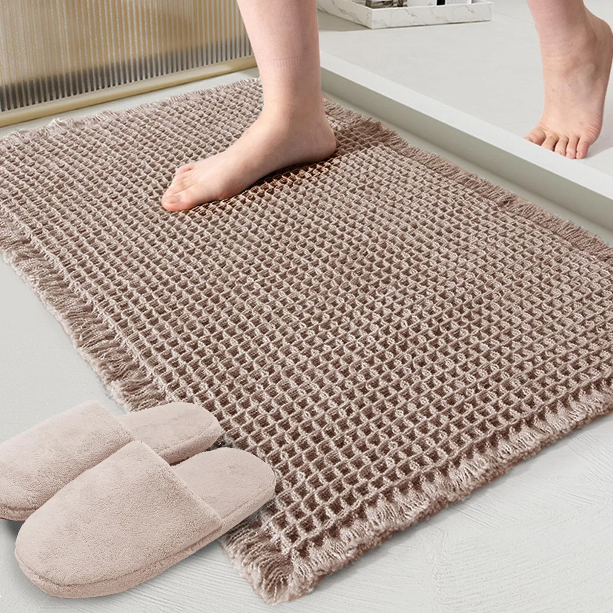 Rectangular brown polyester bath mat with waffle texture, 18 by 30 inches